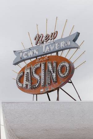 A neon sign signifying the New Town Tavern and Casino, located on F Street and Jackson in the Historic Westside on Jan. 29, 2016.