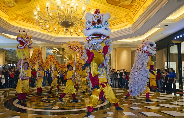 Lion and dragon dancers perform during Chinese New Year celebrations at the Venetian and Palazzo Monday, Feb. 8, 2016. The Chinese New Year, the Year of the Monkey, began Monday.