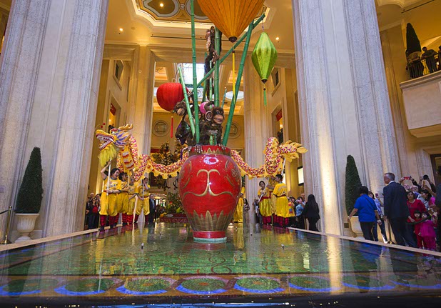 Dragon dancers perform in the Waterfall Atrium and Gardens of The Palazzo during Chinese New Year celebrations Monday, Feb. 8, 2016. The Chinese New Year, the Year of the Monkey, began Monday.