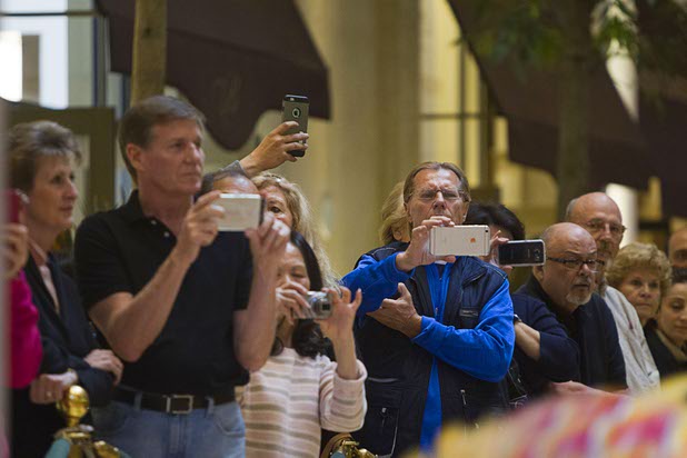 Guests take photos and video of Chinese New Year celebrations at the Waterfall Atrium and Gardens of The Palazzo Monday, Feb. 8, 2016. The Chinese New Year, the Year of the Monkey, began Monday.