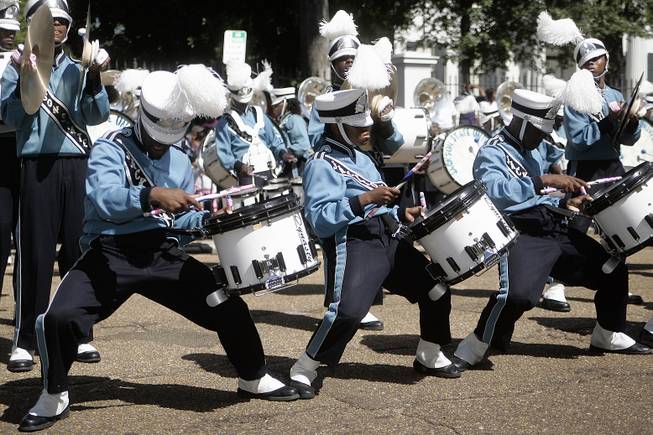 Members of the Jackson State University marching band's drumline breaks out in a dance routine during a rendition of the song, "The Show" by hip-hop artist Doug E. Fresh during the annual homecoming parade, Saturday, Oct. 8, 2011 in Jackson, Miss. 
