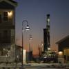 An new oil well is drilled near new apartments in Midland, Texas, Jan. 29, 2016. There are now virtually no wells in the United States profitable to drill. That has forced some companies into a fatal spiral, producing oil simply to satiate their lenders. 