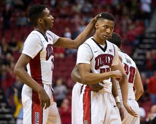 UNLV forward Derrick Jones Jr. (1) and teammates bolster up UNLV guard Patrick McCaw (22) after a tough shot over San Jose State at the Thomas & Mack Center on Wednesday, February 10, 2016.