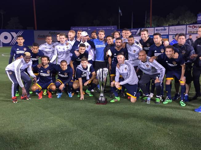 The Los Angeles Galaxy pose with the California Clasico Cup after defeating the San Jose Earthquakes, 1-0, in an MLS exhibition match Saturday, Feb. 13, 2016, at Cashman Field.