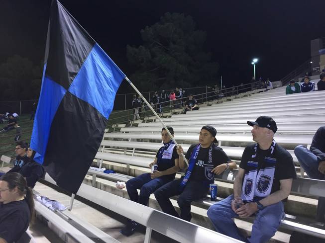 Fans from the San Jose Earthquakes' Ultra fan group hold a flag during halftime of an MLS exhibition match Saturday, Feb. 13, 2016, at Cashman Field.