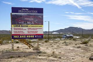 A sign advertises industrial land near Interstate 15 and Highway 93, north of Las Vegas Wednesday, Feb. 17, 2016. Electric car start-up Faraday Future plans to build a $1 billion auto plant in the Apex Industrial Park.