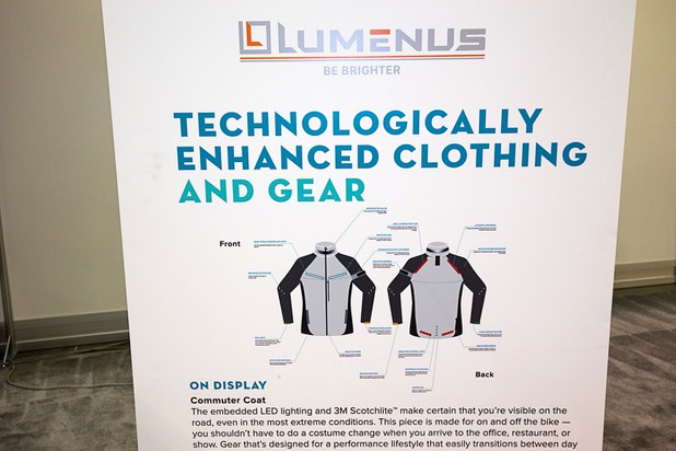 A display gives information on Lumenus products with embedded LED lights during the Magic fashion convention at the Las Vegas Convention Center Thursday, Feb. 18, 2016. The items are machine washable (with battery removed) and can communicate with a smartphone's navigation App via Bluetooth to signal when you will make a turn, said founder Jeremy Wall. The products are expected to be available this summer.