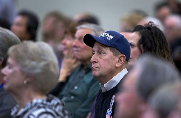 People listen to Republican presidential candidate Ben Carson speaks during a campaign stop at the Mountain Shadows Community Center in Summerlin Tuesday, Feb. 23, 2016.