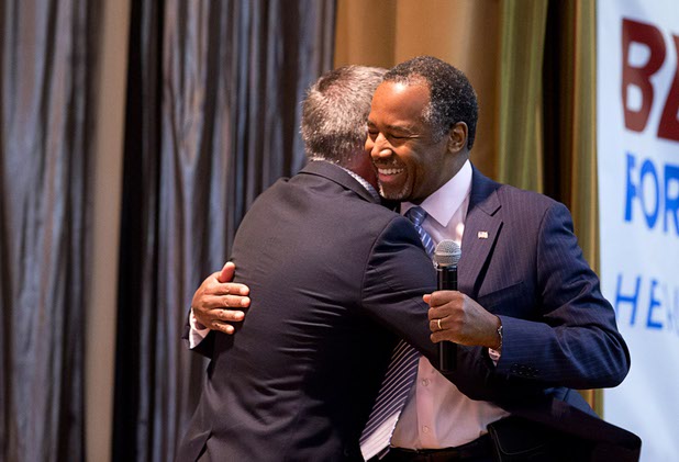 Republican presidential candidate Ben Carson, right, is embraced by Pastor Paul Goulet during a campaign stop at Mountain Shadows Community Center on Tuesday, Feb. 23, 2016, in Summerlin.
