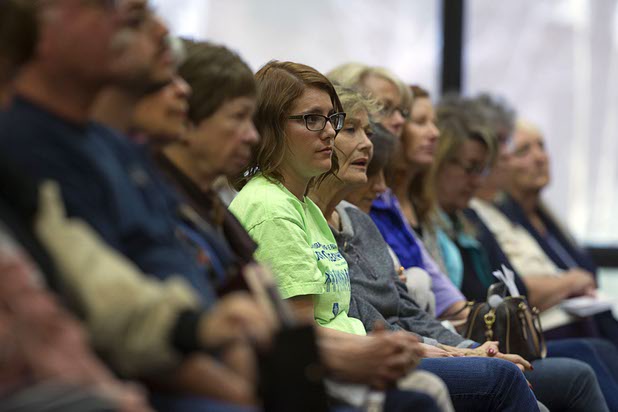 People listen to Republican presidential candidate Ben Carson speaks during a campaign stop at the Mountain Shadows Community Center in Summerlin Tuesday, Feb. 23, 2016.
