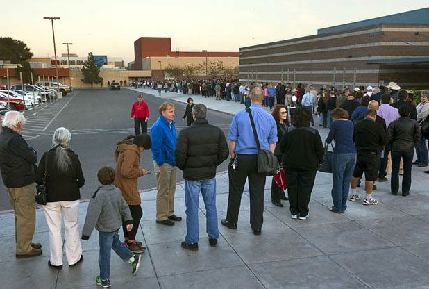 Caucus -goers wait in line at the Western High School GOP caucus site Tuesday, Feb. 23, 2016.