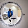 Zarah "Zee" Villareal, a pathology assistant, is framed by a CT scanner at Southern Hills Hospital Monday, Jan. 18, 2016. The scanner is sometimes used to locate areas in the body for biopsies (like a tumor for example).
