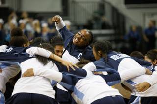 Centennial Bulldogs Guard Tanjanae Wells (00) leads the team in a pregame rally before the NIAA State Girls Championship Basketball game between the Centennial Bulldogs and the Liberty Patriots at Lawlor Events Center on the campus of UNR, Reno, Nevada.