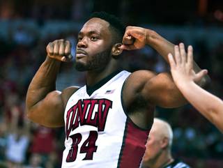 UNLV guard Ike Nwamu (34) flexes for the fans after a powerful drive to the basket solidifying the lead over Wyoming during their game at the Thomas & Mack Center on Saturday, February 27, 2016.