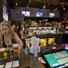 The bar area is busy during the Grand Opening of PT’s Brewing Company at 3101 N. Tenaya Way.