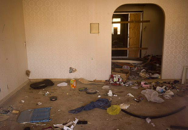 The interior of a vacant home near Viking Road and Eastern Avenue Sunday, Feb. 28, 2016. The home has been damaged by squatters and teens who break in to have parties.