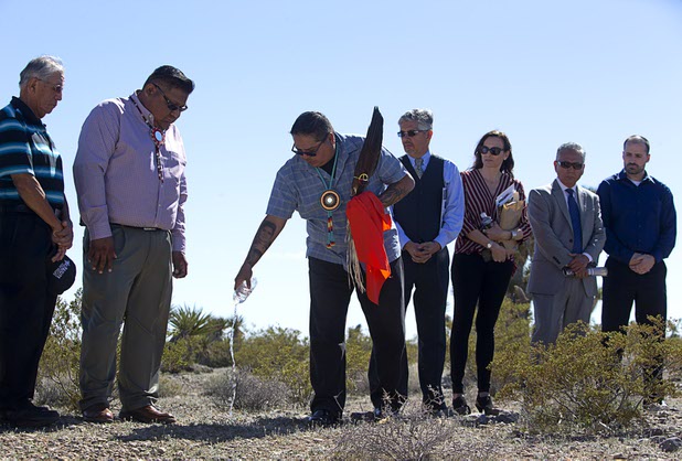 Las Vegas Paiute Vice Chairman Chris Spotted Eagle, third from left, conducts a blessing ceremony on the site of a future medical marijuana cultivation and production facility Monday, Feb. 29, 2016, on Snow Mountain Indian Reservation. The $5 million project is a joint venture between the Las Vegas Paiute tribe and Ultra Health, an Arizona-based company specializing in health care cannabis products.