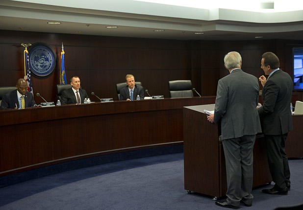 Mark Frissora, right, president and CEO of Caesars Entertainment, responds to questions during a Nevada Gaming Control Board meeting Wednesday, March 2, 2016, at Grant Sawyer State Building. Attorney Frank Schreck stands with Frissora.