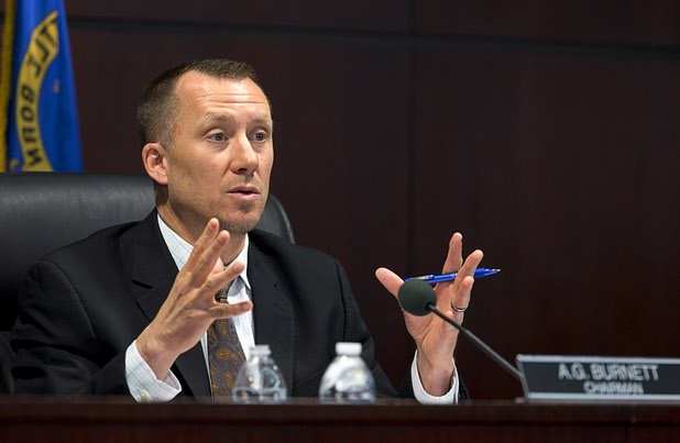 Chairman A.G. Burnett, center, asks a question during a Nevada Gaming Control Board meeting at the Grant Sawyer State Building Wednesday, March 1, 2016. 