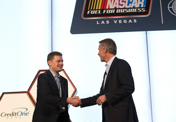 Brian Davis, left, vice president of marketing for Allegiant Air, is welcomed onstage by Steve Phelps, NASCAR executive vice president and chief marketing officer, during a Las Vegas NASCAR Fuel for Business Council meeting at the Cosmopolitan Thursday, March 3, 2016. At the meeting, Phelps and Davis announced that Las Vegas-based Allegiant Air will be the official passenger airline of NASCAR.