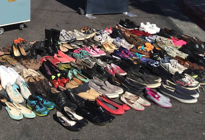 Shoes laid out in front of University Medical Center on Friday, March 4, 2016, represent the number of pedestrian fatalities — 92 — in Nevada from from Jan. 1, 2015, to Feb. 26 this year. 