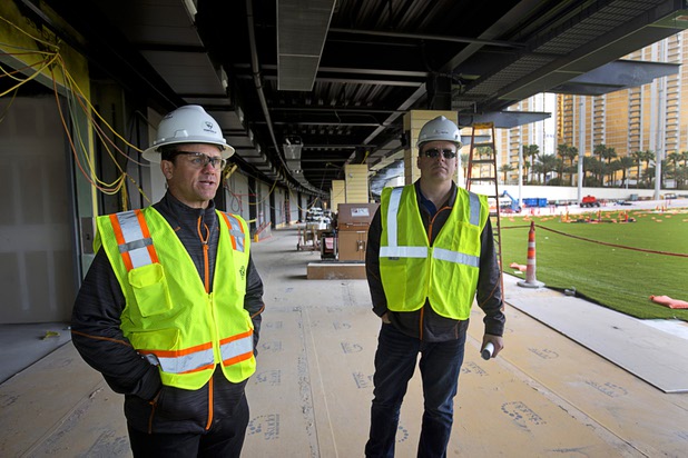 Bryan O’Reilly, left, Topgolf Las Vegas partner, and Johnny McMahon, director of operations, lead a tour of Topgolf Las Vegas under construction at Koval Lane and Harmon Avenue on Monday, March 7, 2016. The 105,00-square-foot entertainment venue will be Topgolf’s flagship location and is expected to open in May.