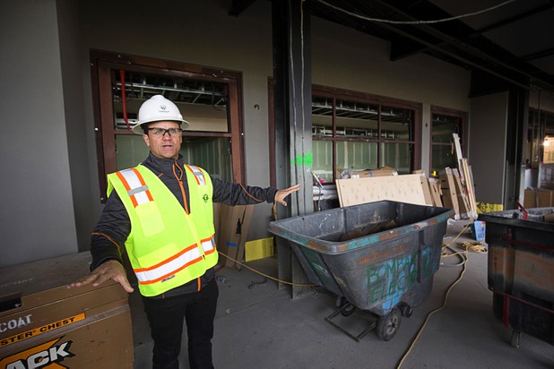 Bryan O’Reilly, left, Topgolf Las Vegas partner, shows off an area that will be the Riv Bar during a tour of Topgolf Las Vegas under construction at Koval Lane and Harmon Avenue on Monday, March 7, 2016. The bar, an homage to the Riviera, will incorporate bar fixtures salvaged from bars at the Riviera.
