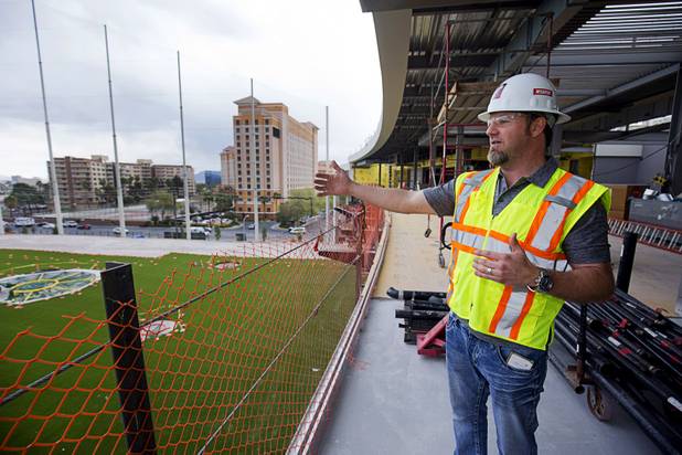 Dominic Crespo, director of construction, gives a tour of Topgolf Las Vegas under construction at Koval Lane and Harmon Avenue on Monday, March 7, 2016. The game is a combination of golf and darts, with players getting points based on how close the balls get to targets on the range. A computer awards the points by reading RFID chips inside the Callaway golf ball.