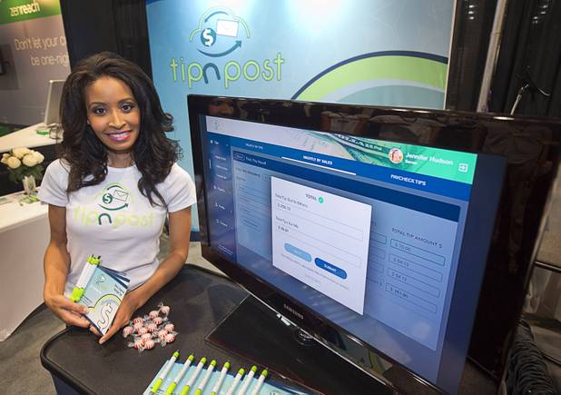 Angel Wallace, CEO of tipnpost, poses in the company's booth during the 2016 Nightclub & Bar convention at the Las Vegas Convention Center Tuesday, March 8, 2016. Tipnpost is a cloud-based web application that connects bar and restaurant staff for the purpose of trading, organizing and managing tips.