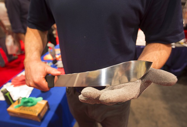 Kevin Reynolds displays a cut-resistant glove at the Double "D" Knitting & Glove Co. booth during the 2016 International Pizza Expo at the Las Vegas Convention Center Tuesday, March 8, 2016. The gloves are made with Dyneema, the wold's strongest fiber, he said.