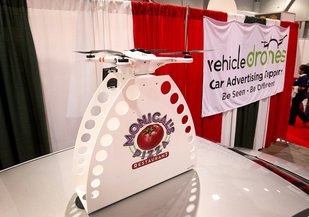 A car advertising topper is shown at the Vehicle Drones booth during the 2016 International Pizza Expo at the Las Vegas Convention Center Tuesday, March 8, 2016. The advertising signs attach to the car with powerful magnets.