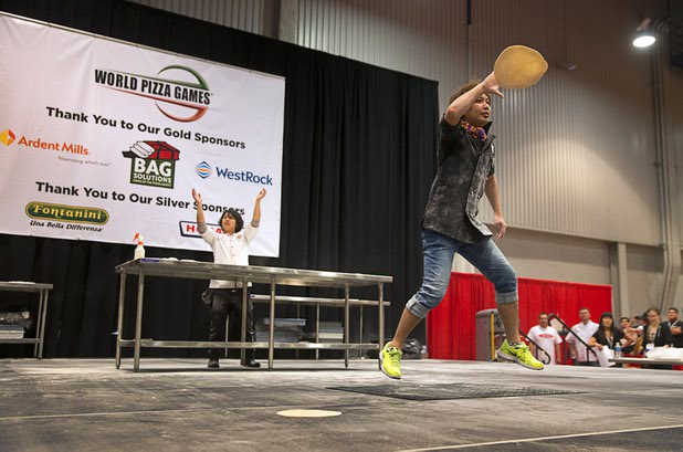 Yuya Mizuno of Japan performs during the World Pizza Games Freestyle Acrobatic Dough Tossing competition at the 2016 International Pizza Expo in the Las Vegas Convention Center Tuesday, March 8, 2016.