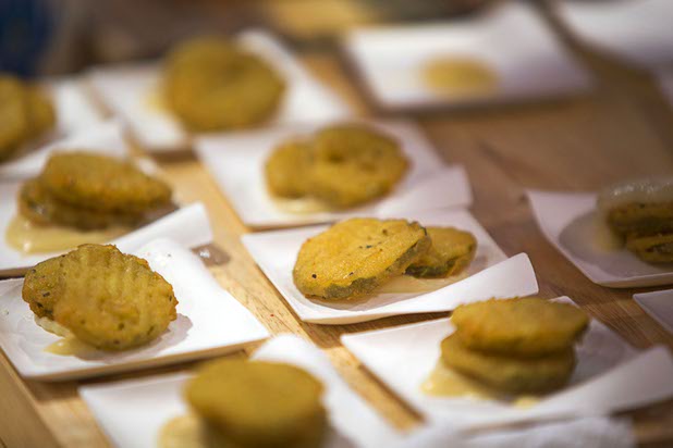 Deep-fried pickles with a white wine and white cheddar sauce are displayed at the Ajinomoto Windsor booth during the 2016 International Pizza Expo at the Las Vegas Convention Center Tuesday, March 8, 2016.
