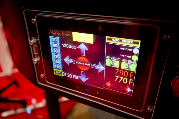 A touch-screen LCD is shown in the front of a Marra Forni rotating pizza oven during the 2016 International Pizza Expo at the Las Vegas Convention Center Tuesday, March 8, 2016. The touch-screen allows the operator to easily change the rotation cycle, speed and direction.