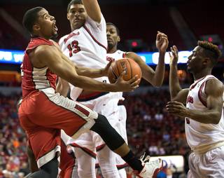 UNLV guard Jerome Seagears (2) fights inside of Fresno State forward Cullen Russo (13) during their Mountain West Championship second game versus Fresno State at the Thomas & Mack Center on Thursday, March 10, 2016.