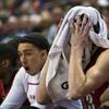 UNLV forward Stephen Zimmerman Jr. is shown on the bench with a towel over his head after fouling out against Fresno State during their Mountain West Tournament quarterfinal game at the Thomas & Mack Center, Thursday, March 10, 2016.