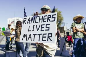 A supporter of Nevada rancher Cliven Bundy holds a sign in front of the U.S. Courthouse in downtown Las Vegas Thursday, March 10, 2016. Bundy is facing charges relating to an armed ranching standoff against Bureau of Land Management agents in April 2014.