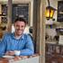 Jonathan Pluvinet owns Rosallie Le French Café. He laid the brick counter himself, and the lantern to his left was once his grandfather’s.