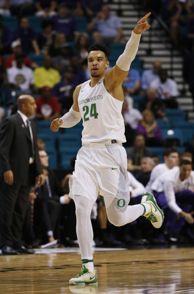 Oregon forward Dillon Brooks reacts after scoring against Washington during the first half of an NCAA college basketball game in the quarterfinal round of the Pac-12 men's tournament Thursday, March 10, 2016, in Las Vegas.