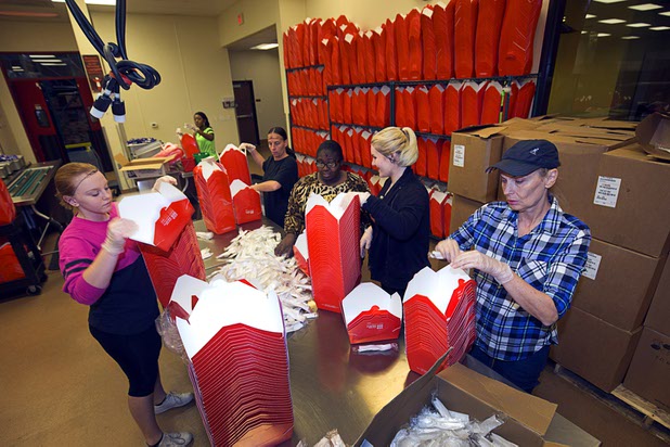 Volunteers work in the community kitchen at Three Square food bank's north campus in March. Three Square was among the 30 organizations represented at a Henderson Chamber of Commerce mixer Tuesday to match businesses with charities.