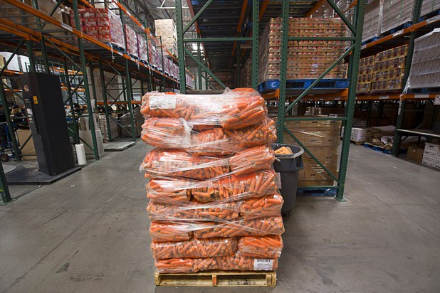 Bags of carrots are shown in the warehouse at Three Squares north campus, 4220 N. Pecos Rd., Wednesday, March 16, 2016.