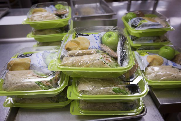 Meals for a catering job are shown in the Community Kitchen at Three Squares north campus, 4220 N. Pecos Rd., Wednesday, March 16, 2016.