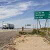 A trucker drives across the highway 7 miles from Cal-Nev-Ari, Nev., on March 2, 2016. 