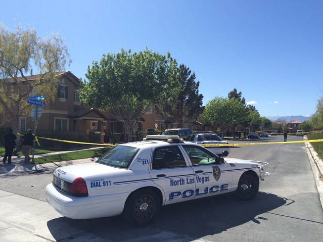 North Las Vegas Police investigate a homicide in the 4400 block of Nestos Valley Avenue, near West Ann Road and North Decatur Avenue, on Friday, March 18, 2016.