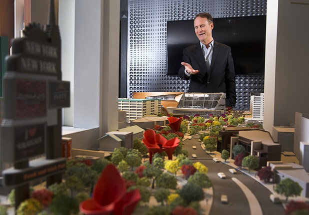 Mark Faber, senior vice president of global partnerships at AEG/T-Mobile Arena, gestures toward a model of the arena at the T-Mobile marketing center Monday, March 21, 2016.