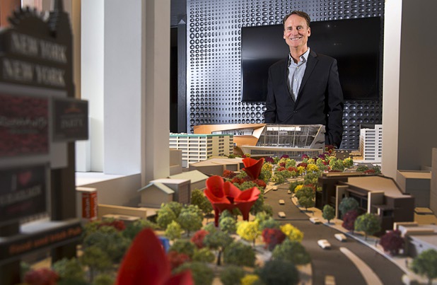 Mark Faber, senior vice president of global partnerships at AEG/T-Mobile Arena, poses by a model of the arena at the T-Mobile marketing center Monday, March 21, 2016.