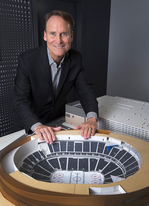 Mark Faber, senior vice president of global partnerships at AEG/T-Mobile Arena, poses by a model of the arena at the T-Mobile marketing center Monday, March 21, 2016.