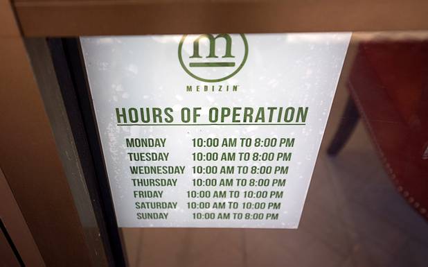 A sign gives hours of operation at Medizin, a medical marijuana dispensary at 4850 W Sunset Rd., Tuesday, March 22, 2016. The dispensary is scheduled to open on Friday, April 1.