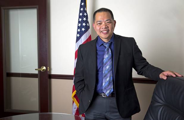 Sonny Vinuya, president of the Asian Chamber of Commerce, poses in a conference room at Nevada State Bank Tuesday, March 22, 2016. Vinuya is also a vice president/ small business relationship manager at the bank.