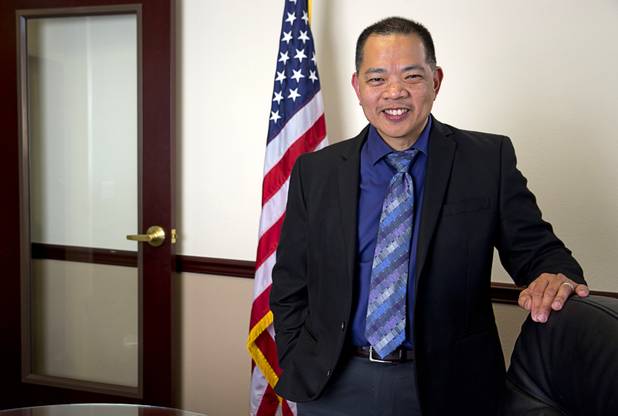 Sonny Vinuya, president of the Asian Chamber of Commerce, poses in a conference room at Nevada State Bank Tuesday, March 22, 2016. Vinuya is also a vice president/ small business relationship manager at the bank.